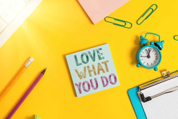 Conceptual hand writing showing Love What You Do. Business photo showcasing has passion and enthusiasm at work Dedication Devotion Flat lay above copy space on the white crumpled paper.