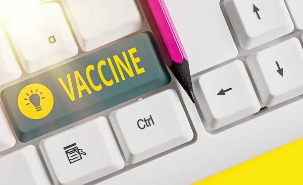 Ordskrivning text Vaccin. Affärsidé för beredning av avlivade mikroorganismer eller levande försvagade organismer Vitt tangentbord med tomt anteckningspapper ovanför vitt nyckelkopieringsutrymme. — Stockfoto