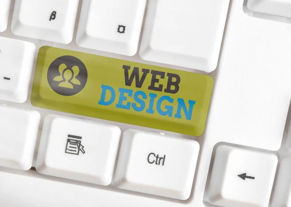 Signo de texto mostrando Diseño Web. Creación de sitios web de fotos conceptuales que incluye diseño, contenido y gráficos Teclado de PC blanco con papel de nota vacío sobre espacio de copia de tecla blanca . —  Fotos de Stock