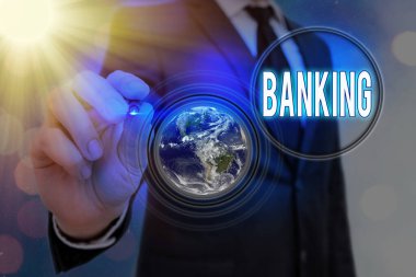 Bankacılık 'ı gösteren bir not yazıyorum. Yatırımlar almak ve NASA tarafından desteklenen bu görüntünün elementlerini yapmak için lisanslı işletme fotoğrafı sergileniyor..