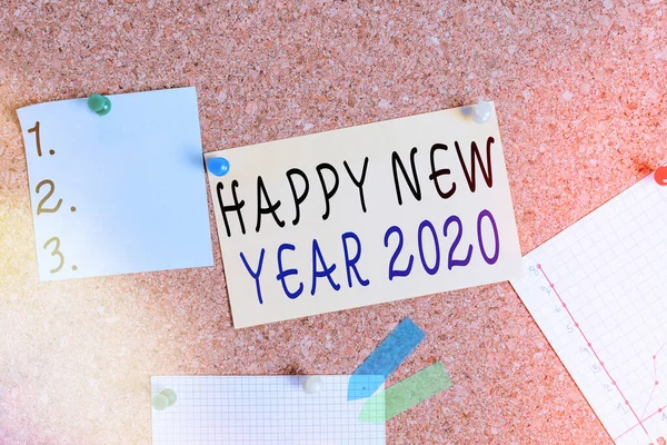 Word writing text Happy New Year 2020. Business concept for celebration of the beginning of the calendar year 2020 Corkboard color size paper pin thumbtack tack sheet billboard notice board.