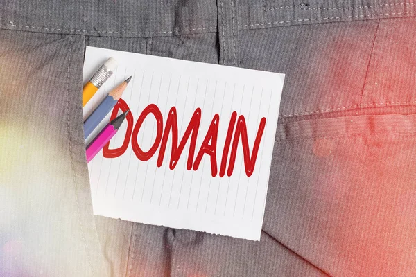 Word writing text Domain. Business concept for identification string that defines a realm of administrative autonomy Writing equipment and white note paper inside pocket of man work trousers. — Stock Photo, Image