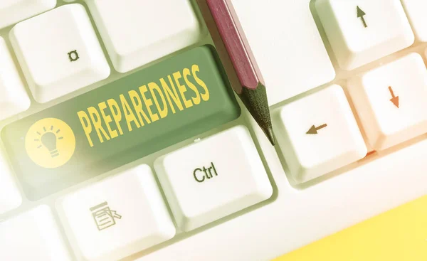 Word writing text Preparedness. Business concept for quality or state of being prepared in case of unexpected events White pc keyboard with empty note paper above white key copy space. — Stock Photo, Image