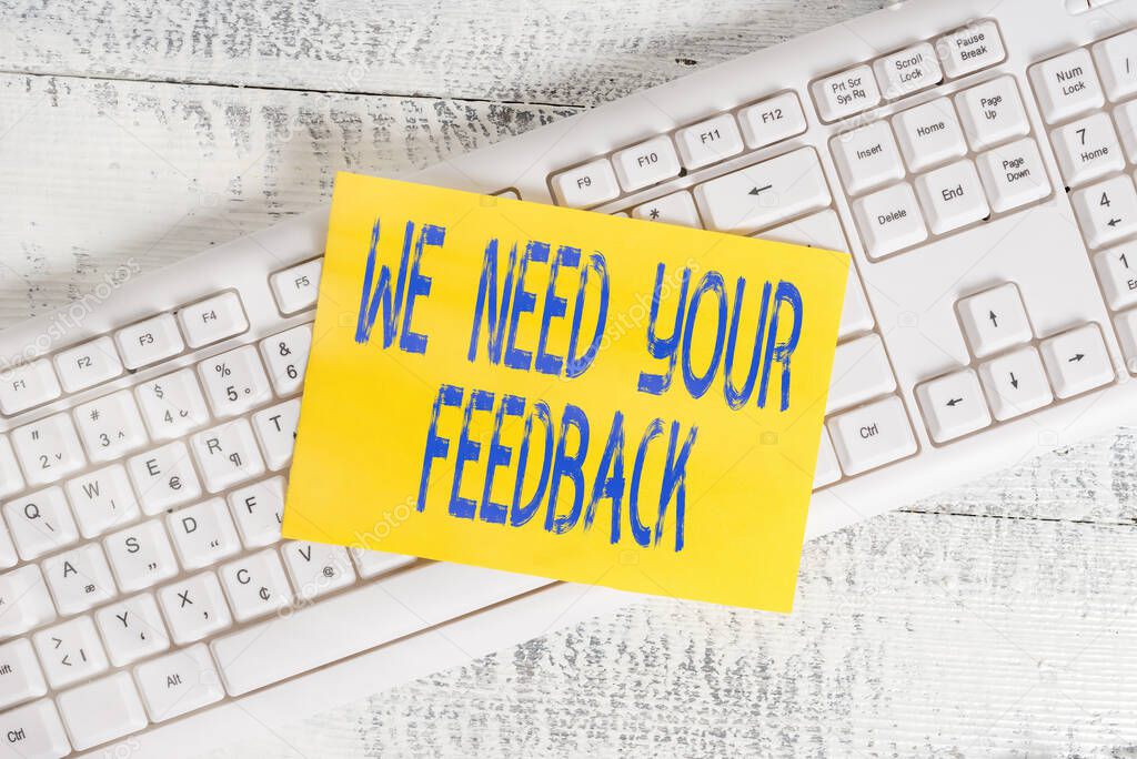 Handwriting text We Need Your Feedback. Concept meaning Give us your ideas and suggestions on what to improve White keyboard office supplies empty rectangle shaped paper reminder wood.