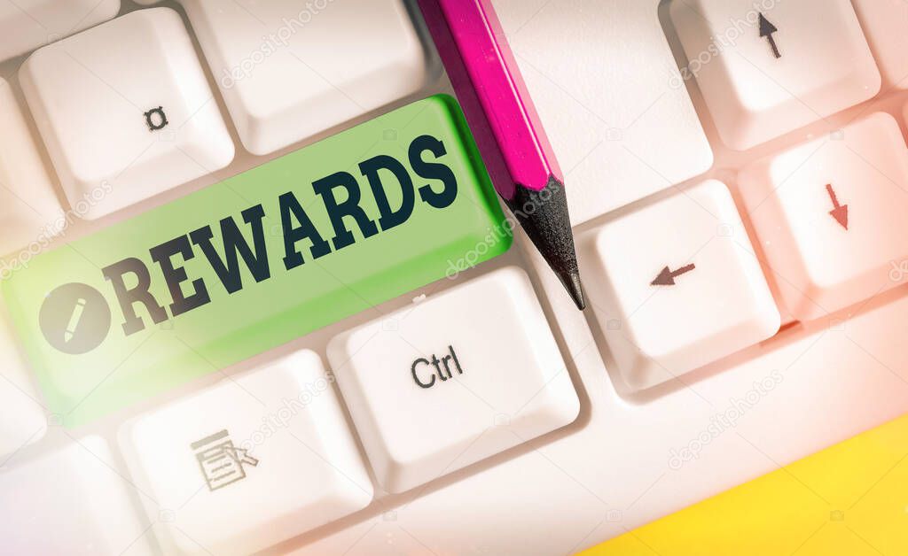 Writing note showing Rewards. Business photo showcasing certain number or percentage you earn for every dollar you charge.