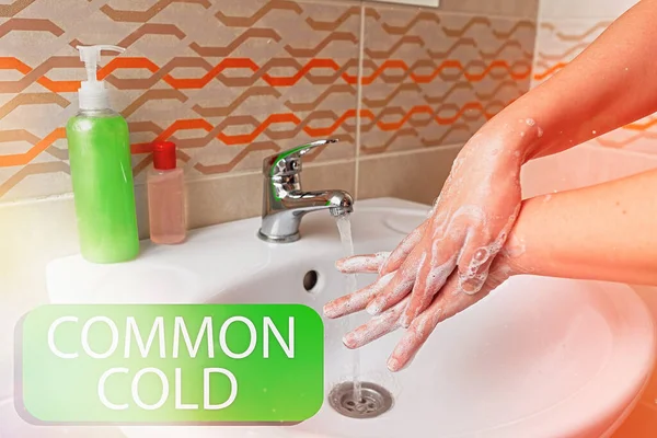 Writing note showing Common Cold. Business photo showcasing viral infection in upper respiratory tract primarily affecting nose Handwashing procedures for decontamination and minimizing bacteria.