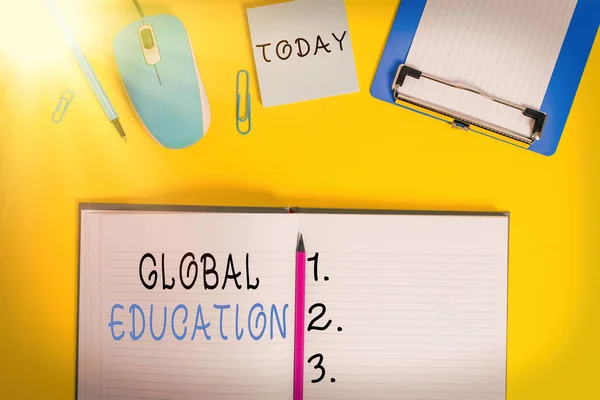 Word writing text Global Education. Business concept for interdisciplinary approach to learning concepts necessary Clipboard sheet clip striped notepad mouse markers note colored background.