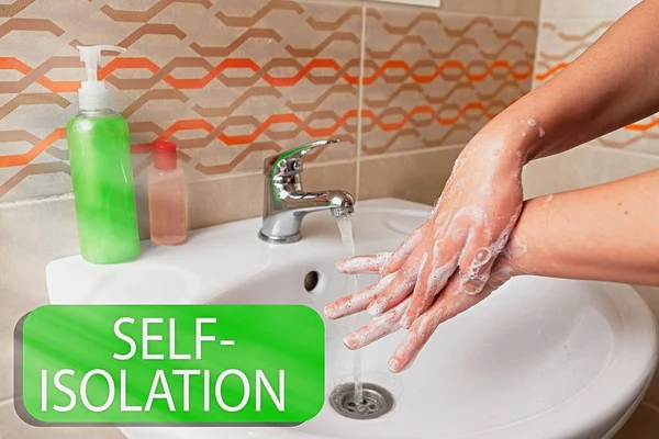 Writing note showing Self Isolation. Business photo showcasing promoting infection control by avoiding contact with the public Handwashing procedures for decontamination and minimizing bacteria.