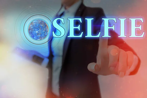 Word writing text Selfie. Business concept for taken by oneself using a digital camera for posting on social network Futuristic icons solar system. Elements of this image furnished by NASA.