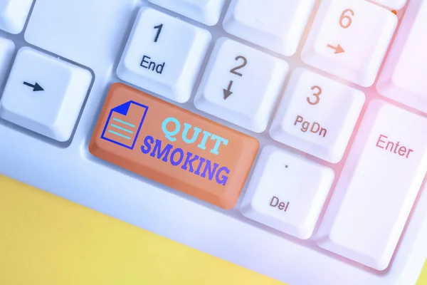 Writing note showing Quit Smoking. Business photo showcasing the process of discontinuing or stopping tobacco smoking White pc keyboard with empty note paper above white key copy space. — Stock Photo, Image