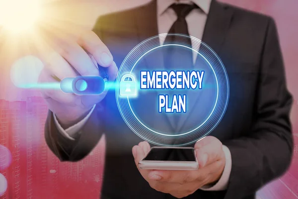 Writing note showing Emergency Plan. Business photo showcasing instructions that outlines what workers should do in danger Graphics padlock for web data information security application system.