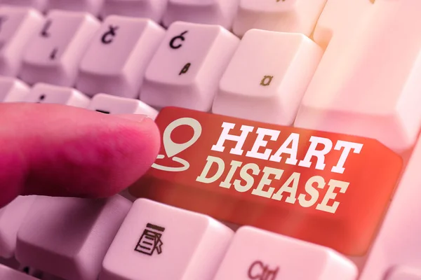 Word writing text Heart Disease. Business concept for A type of disease that affects the heart or blood vessels White pc keyboard with empty note paper above white key copy space. — Stock Photo, Image