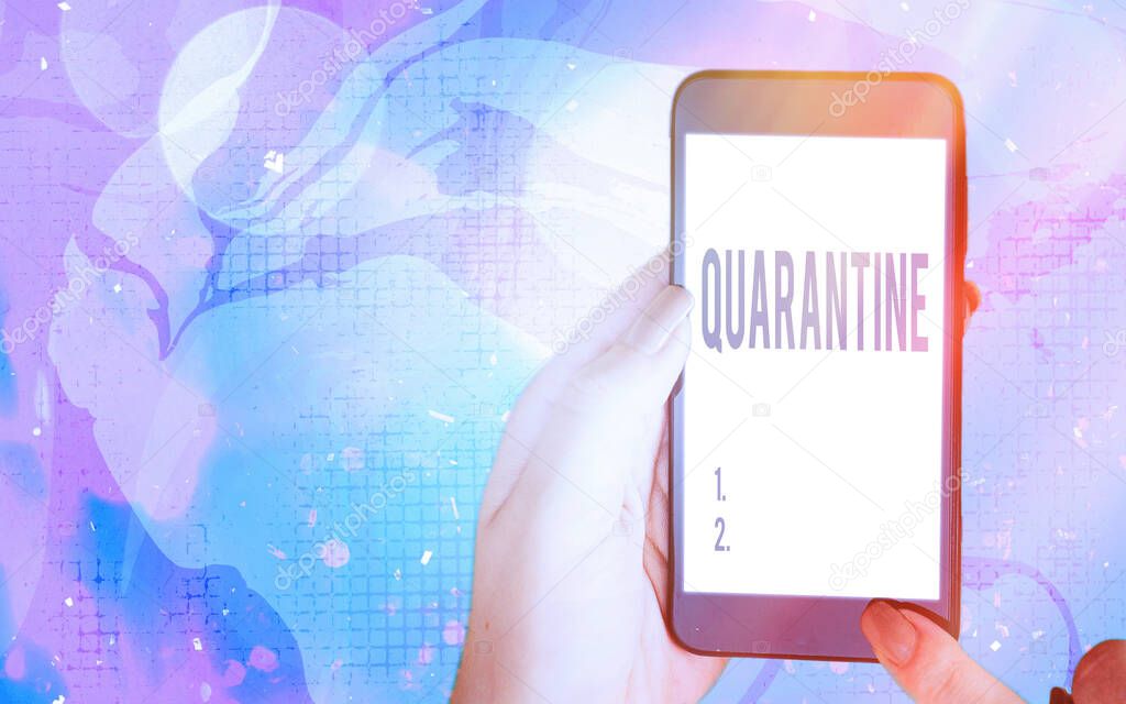 Word writing text Quarantine. Business concept for restraint upon the activities of an individual or the transport of goods Modern gadgets with white display screen under colorful bokeh background.