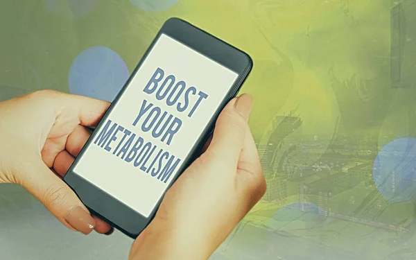Handwriting text Boost Your Metabolism. Concept meaning body process uses to make and burn energy from food Modern gadgets with white display screen under colorful bokeh background.