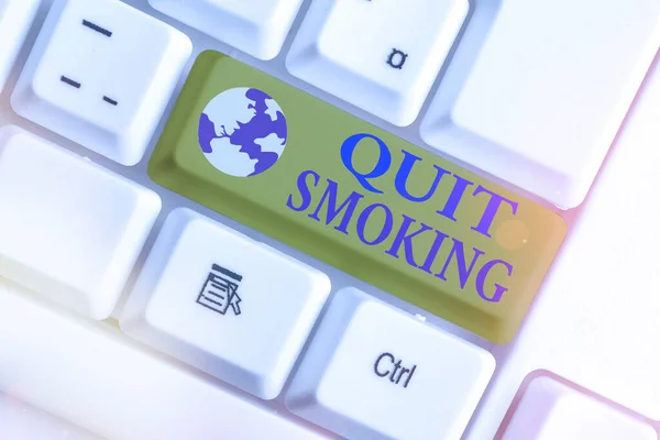Word writing text Quit Smoking. Business concept for the process of discontinuing or stopping tobacco smoking White pc keyboard with empty note paper above white key copy space. — Stock Photo, Image