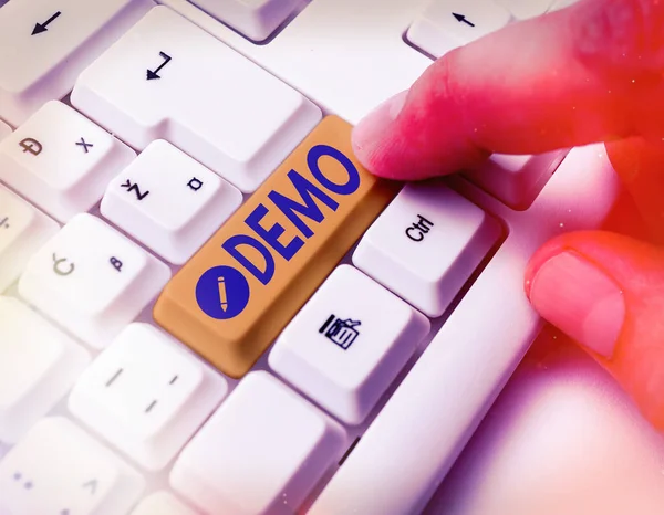 Writing note showing Demo. Business photo showcasing exemplification display expression show visual communication reflection White pc keyboard with empty note paper above white key copy space.