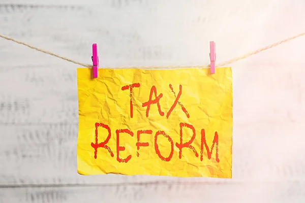 Word writing text Tax Reform. Business concept for government policy about the collection of taxes with business owners Clothesline clothespin rectangle shaped paper reminder white wood desk. — Stock Photo, Image