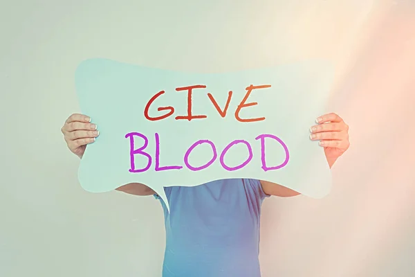 単語の執筆テキスト血を与えなさい。個人のためのビジネスコンセプトは自発的に血が描かれ、輸血に使用されています空のバブルチャットステッカーメモは、個人的なアイデアの概念を強調モックアップ. — ストック写真