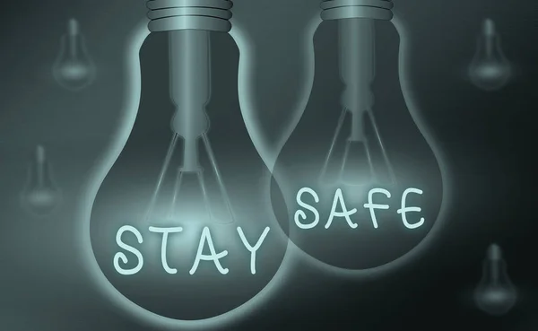 Text sign showing Stay Safe. Conceptual photo secure from threat of danger, harm or place to keep articles Realistic colored vintage light bulbs, idea sign solution thinking concept. — Stock Photo, Image