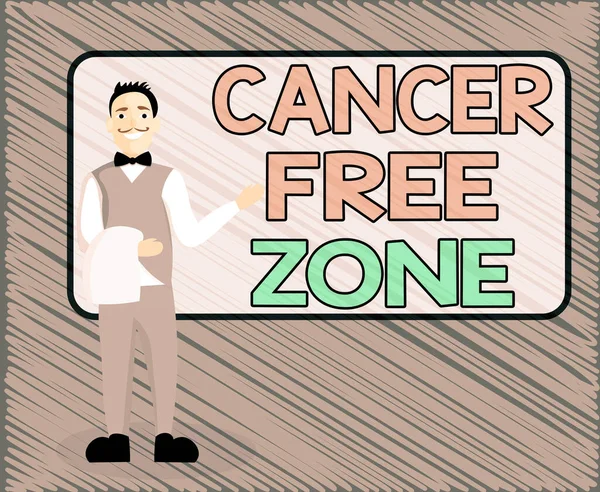 Text sign showing Cancer Free Zone. Conceptual photo supporting cancer patients and raising awareness of cancer Male Waiter Smiling Standing in Uniform Hand Presenting Blank Menu Board.
