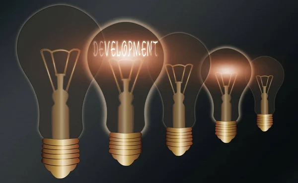 Handwriting text writing Development. Concept meaning a cycle in which somebody or something grows or changes Realistic colored vintage light bulbs, idea sign solution thinking concept. — Stock Photo, Image