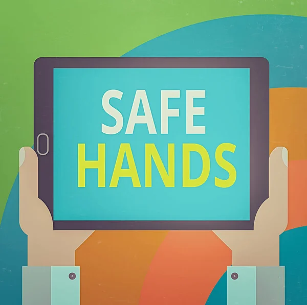 Conceptual hand writing showing Safe Hands. Business photo showcasing Ensuring the sterility and cleanliness of the hands for decontamination Hu analysis Holding Tablet Smartphone Display Unit photo.