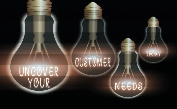 Handwriting text Uncover Your Customer Needs. Concept meaning reveal product and present solution to consumer Realistic colored vintage light bulbs, idea sign solution thinking concept.