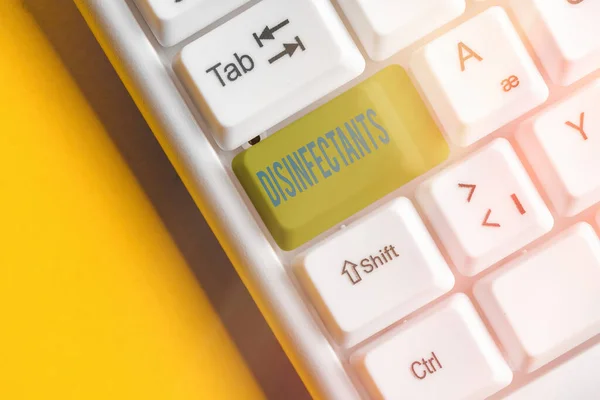 Writing note showing Disinfectants. Business photo showcasing chemical that destroy vegetative form of harmful microorganism White pc keyboard with empty note paper above white key copy space. — Stock Photo, Image