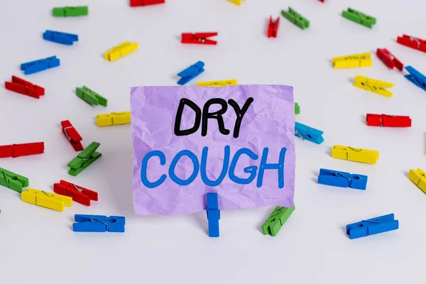 Writing note showing Dry Cough. Business photo showcasing cough that are not accompanied by phlegm production or mucus Colored clothespin papers empty reminder white floor background office. — Stock Photo, Image