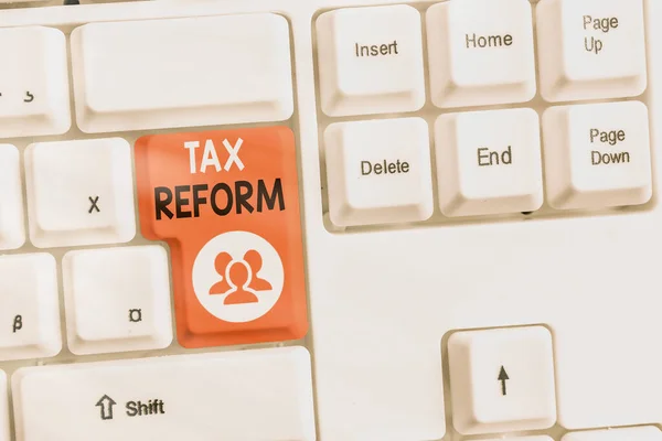 Text sign showing Tax Reform. Conceptual photo government policy about the collection of taxes with business owners Different colored keyboard key with accessories arranged on empty copy space.