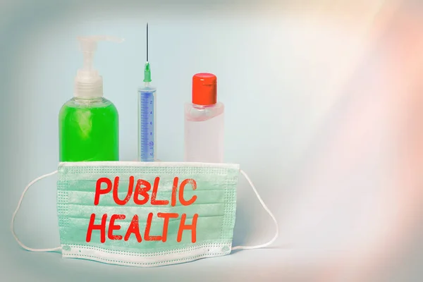 Conceptual hand writing showing Public Health. Business photo showcasing science of protecting and improving the health of a community Primary medical precautionary equipments health protection.