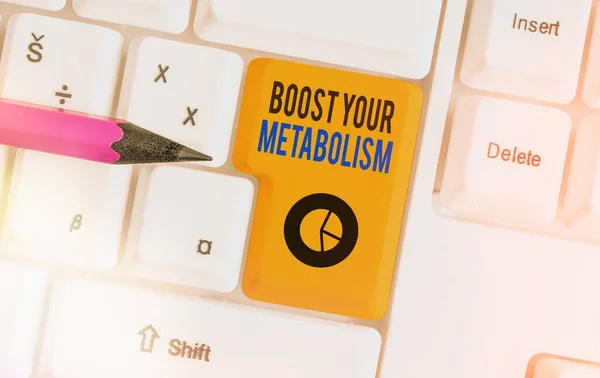 Conceptual hand writing showing Boost Your Metabolism. Business photo showcasing body process uses to make and burn energy from food Colored keyboard key with accessories arranged on copy space.