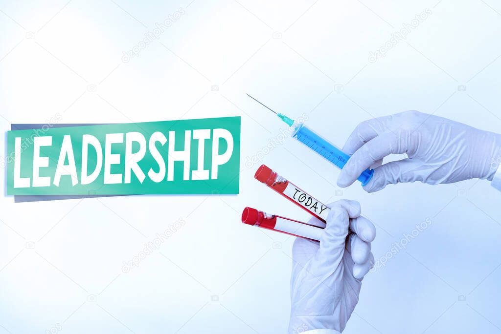 Word writing text Leadership. Business concept for art of motivating to act toward achieving a common goal Extracted blood sample vial ready for medical diagnostic examination.