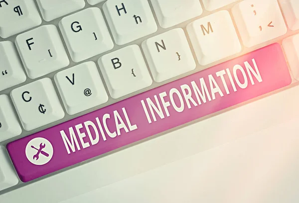 Writing note showing Medical Information. Business photo showcasing an individual demographic information and medical histories Colored keyboard key with accessories arranged on empty copy space.