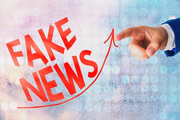 Word writing text Fake News. Business concept for false information publish under the guise of being authentic news digital arrowhead curve rising upward denoting growth development concept.