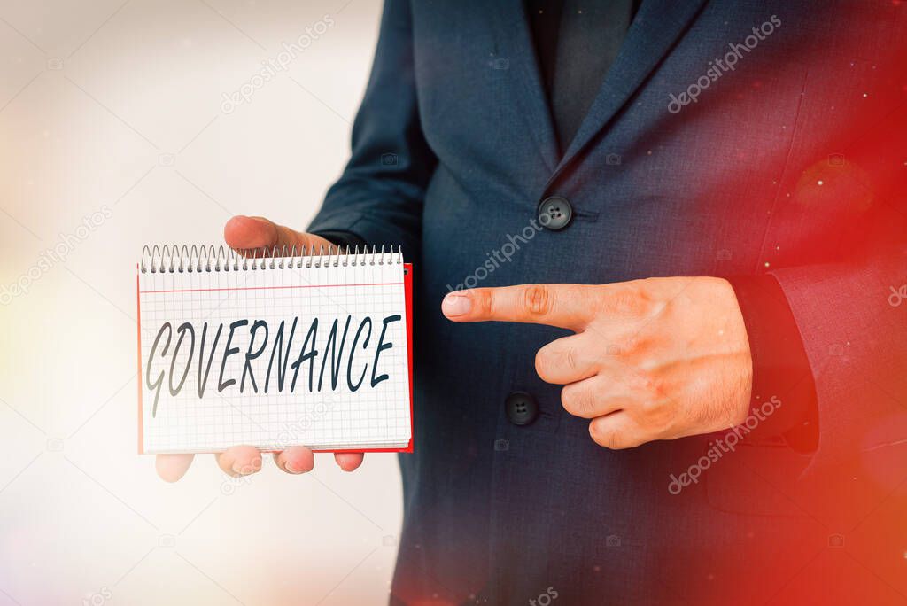 Handwriting text Governance. Concept meaning exercised in handling an economic situation in a nation Model displaying different empty color notepad mock-up for writing idea.