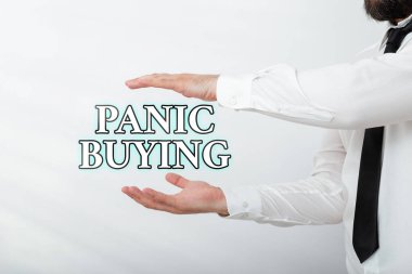 Kelime yazarı Panik Satın Alma. Yaklaşan kıtlık korkusuyla büyük miktarlarda mal satın almak için kullanılan iş konsepti. El işareti ile seyrüsefer gelişimi büyümesini sembolize ediyor..