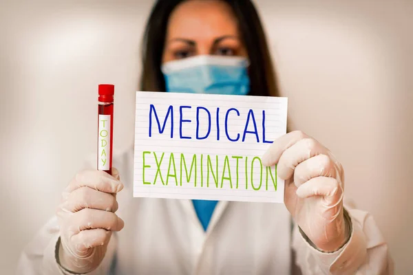 Writing note showing Medical Examination. Business photo showcasing the examination carried out to determine physical fitness Laboratory blood test sample for medical diagnostic analysis.