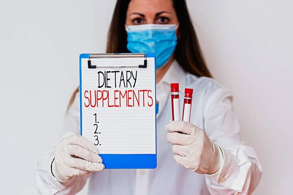 Text sign showing Dietary Supplements. Conceptual photo product intended to supplement the diet taken orally Laboratory blood test sample shown for medical diagnostic analysis result. — Stock Photo, Image