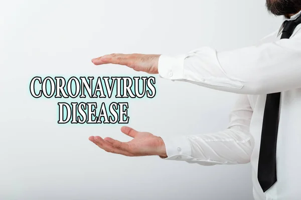 Слово писать текст Coronavirus Disease. Бизнес-концепция для определения болезни, вызванной новым вирусом SARSCoV2 Модель с указательным пальцем, символизирующим рост навигационного прогресса . — стоковое фото