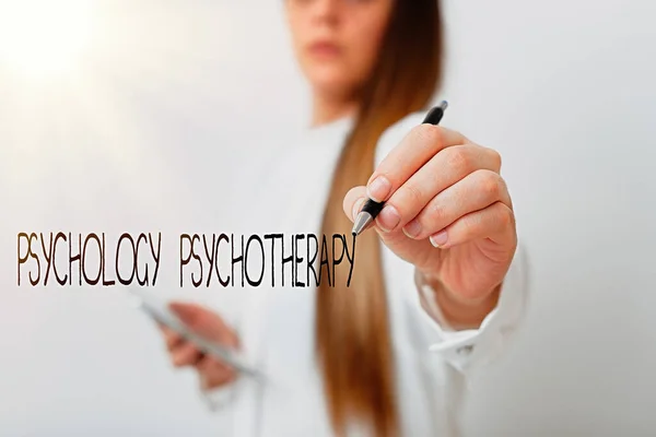 Word writing text Psychology Psychotherapy. Business concept for use of a psychological method to treat mental illness Model displaying different shots of holding pen ready for promotional use.