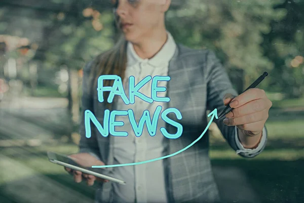 Word writing text Fake News. Business concept for false information publish under the guise of being authentic news digital arrowhead curve rising upward denoting growth development concept.