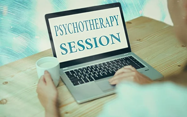 Handwriting text writing Psychotherapy Session. Concept meaning series of meetings in treating mental health problems Modern gadgets with white display screen under colorful bokeh background.