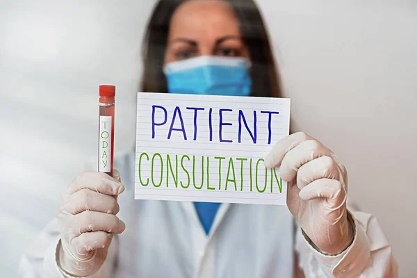 Writing note showing Patient Consultation. Business photo showcasing examinings discuss a patient and his or her condition Laboratory blood test sample for medical diagnostic analysis. — Stock Photo, Image