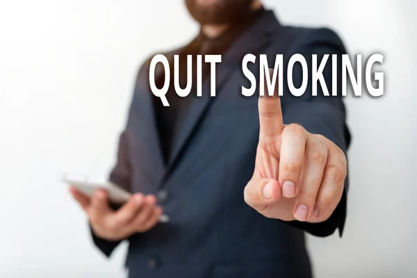 Text sign showing Quit Smoking. Conceptual photo the process of discontinuing or stopping tobacco smoking Model with pointing hand finger symbolizing navigation progress growth. — Stock Photo, Image