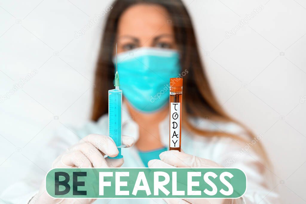 Text sign showing Be Fearless. Conceptual photo act of striving to lead an extraordinary life and make a difference Laboratory blood test sample shown for medical diagnostic analysis result.