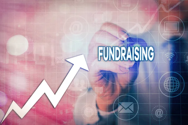 Writing note showing Fundraising. Business photo showcasing applying for financial aid for a charity, cause or undertaking Arrow symbol going upward showing significant achievement.