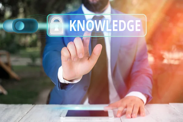Writing note showing Knowledge. Business photo showcasing skills that an individual has gained through experience or education Graphics padlock for web data information security application system.