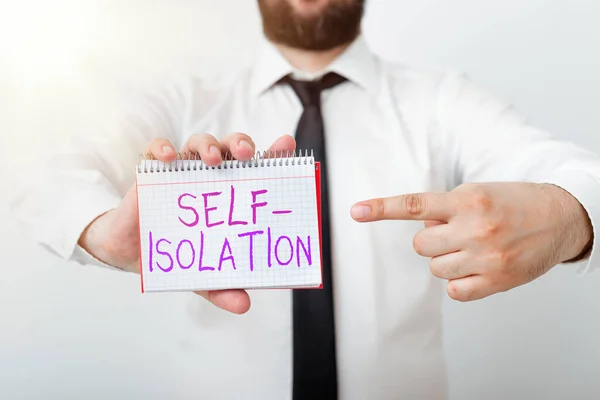 Writing note showing Self Isolation. Business photo showcasing promoting infection control by avoiding contact with the public Model displaying different empty color notepad mock-up for writing idea.