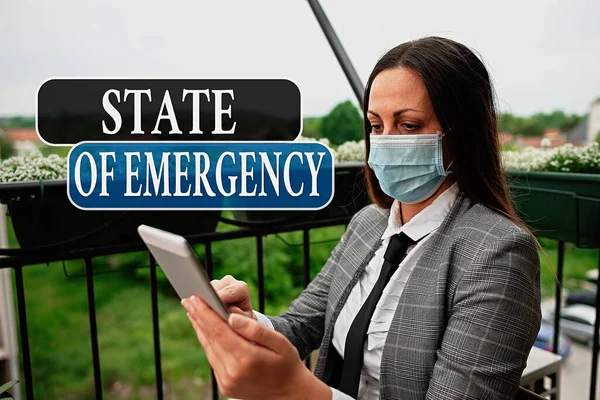 Conceptual hand writing showing State Of Emergency. Business photo text acknowledging an extreme condition affecting at a national level Promoting health awareness with precautionary medical equipment